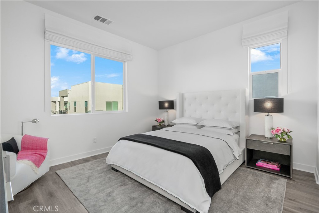 27225 Cranmore Way, Unit 101 Valencia, CA 91381 - Photo 21 of 36 a bedroom with a bed and a couch