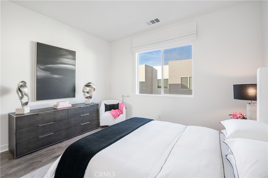 27225 Cranmore Way, Unit 101 Valencia, CA 91381 - Photo 22 of 36 a bedroom with a bed and a dresser