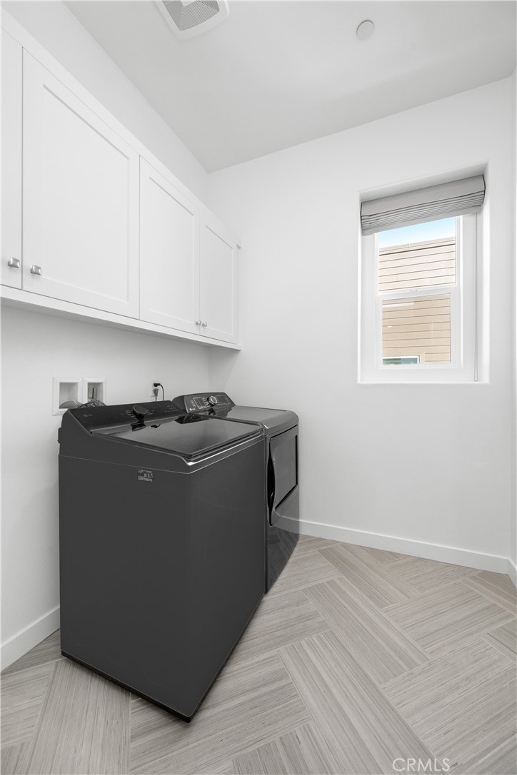 27225 Cranmore Way, Unit 101 Valencia, CA 91381 - Photo 24 of 36 a room with wooden cabinets