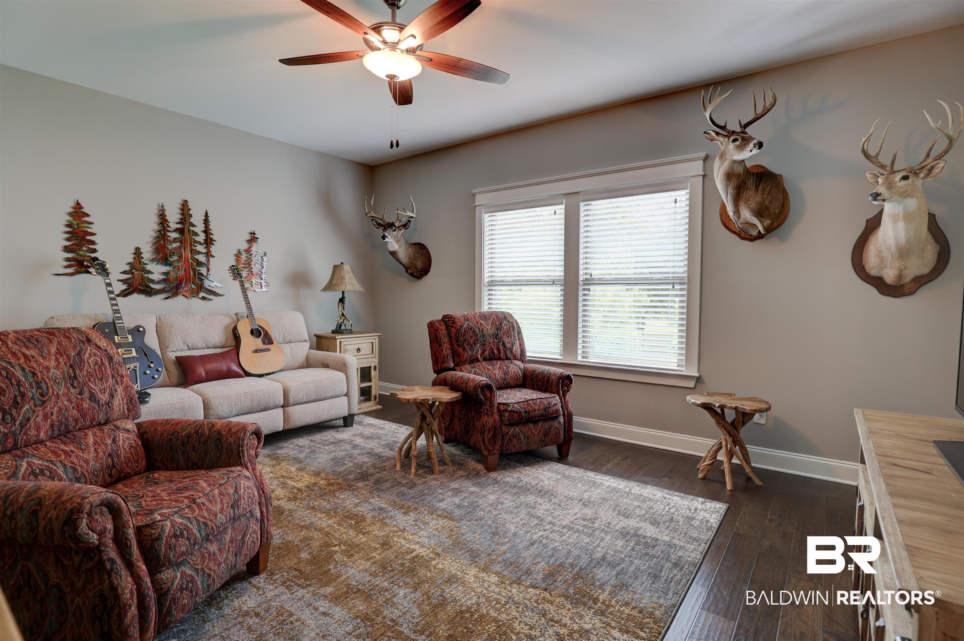 10588 Leesburg Pike Daphne, AL 36526 - Photo 6 of 29 Living room with dark hardwood / wood-style floors and ceiling fan