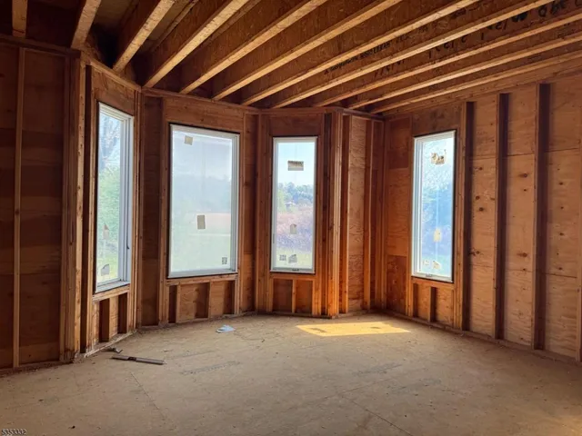 a view of a room with wooden walls