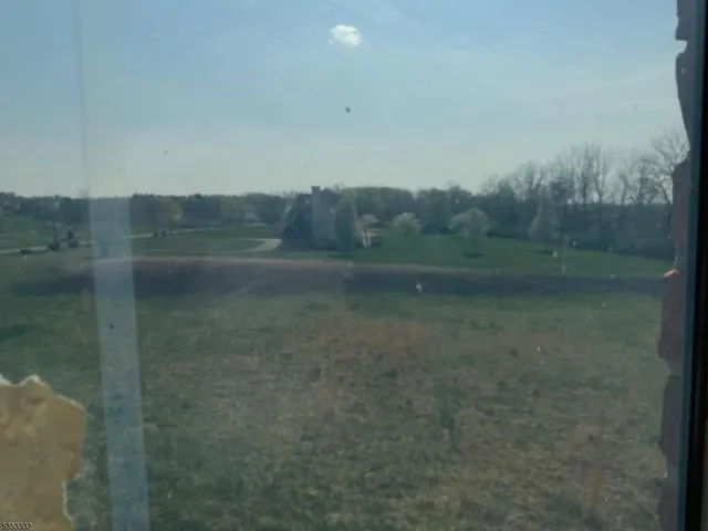 a view of a front door and deck of the house