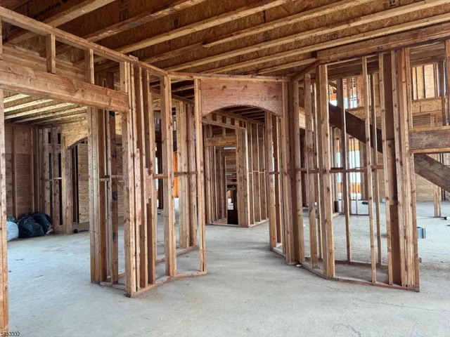 a view of a hallway with wooden walls