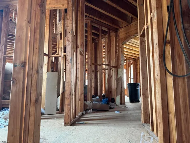 a view of a door with a door and wooden bench