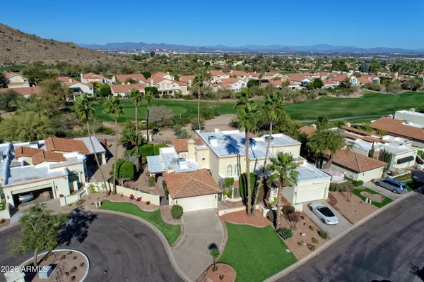 an aerial view of a house with outdoor space