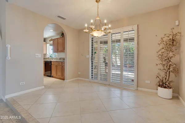 a view of a room with window and chandelier