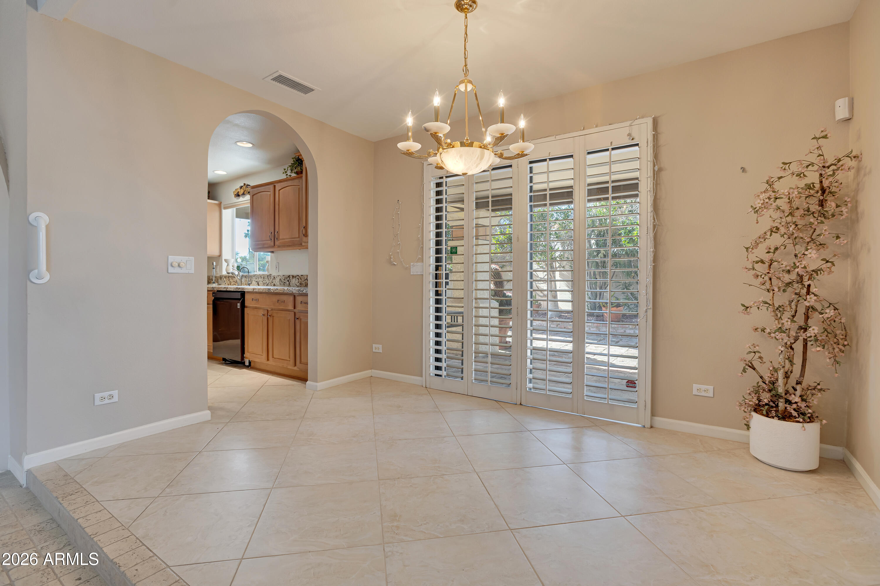 4610 East Monte Way Phoenix, AZ 85044 - Photo 12 of 44 a view of a room with window and chandelier