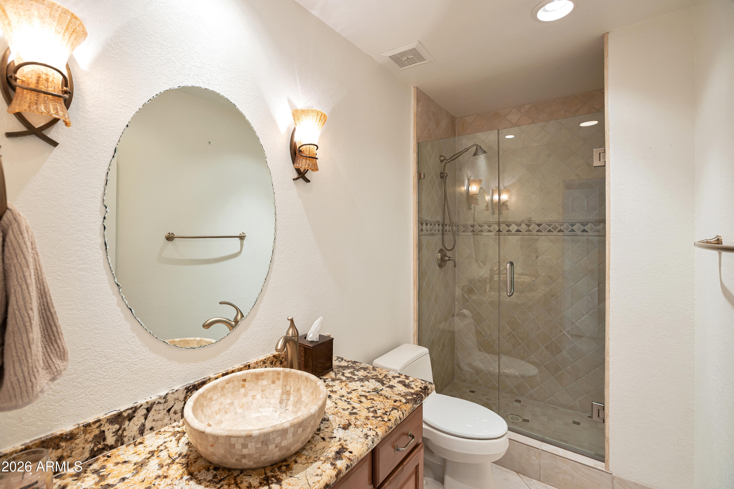 4610 East Monte Way Phoenix, AZ 85044 - Photo 17 of 44 a bathroom with a sink a toilet and a mirror