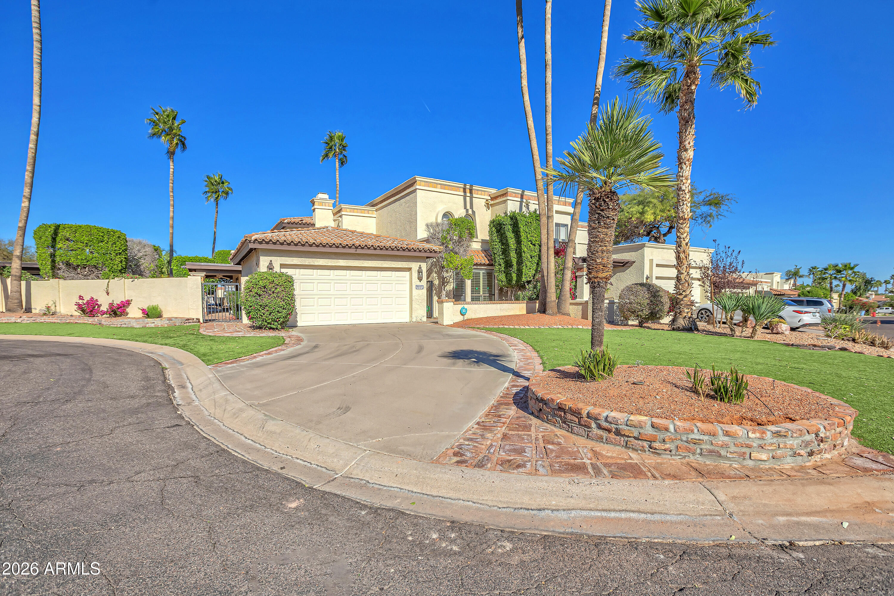 4610 East Monte Way Phoenix, AZ 85044 - Photo 2 of 44 a view of a house with a yard and potted plants