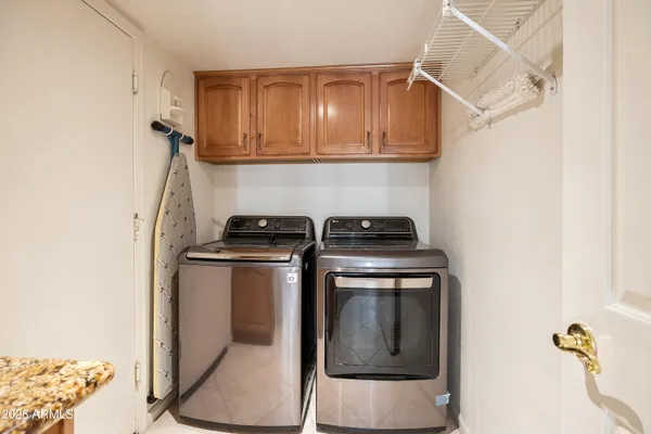 a utility room with dryer and washer