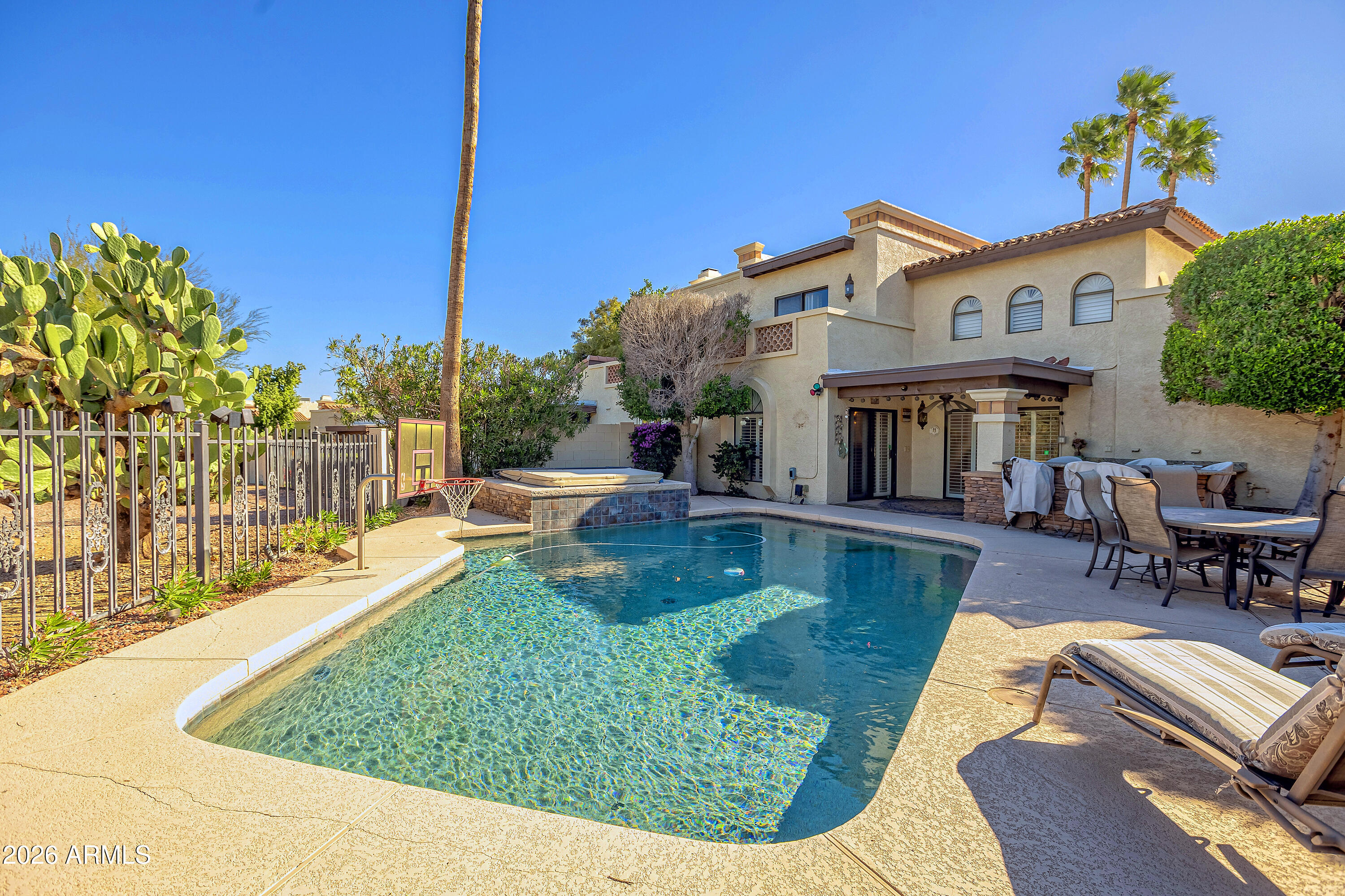4610 East Monte Way Phoenix, AZ 85044 - Photo 3 of 44 a view of a house with swimming pool and sitting area