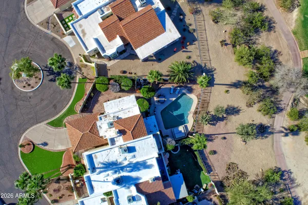an aerial view of residential houses with outdoor space