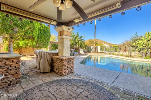 a view of swimming pool with a patio