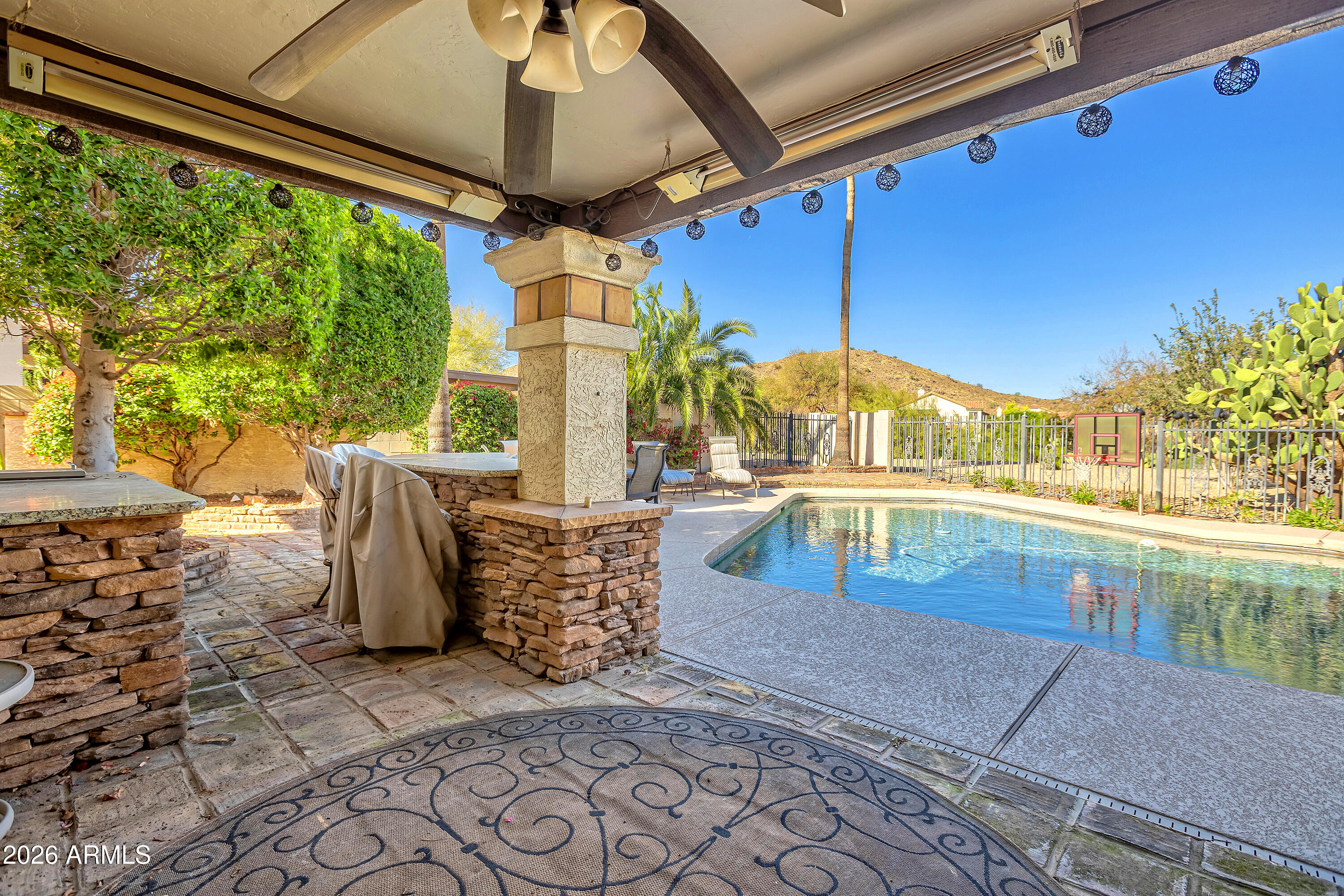 4610 East Monte Way Phoenix, AZ 85044 - Photo 4 of 44 a view of swimming pool with a patio