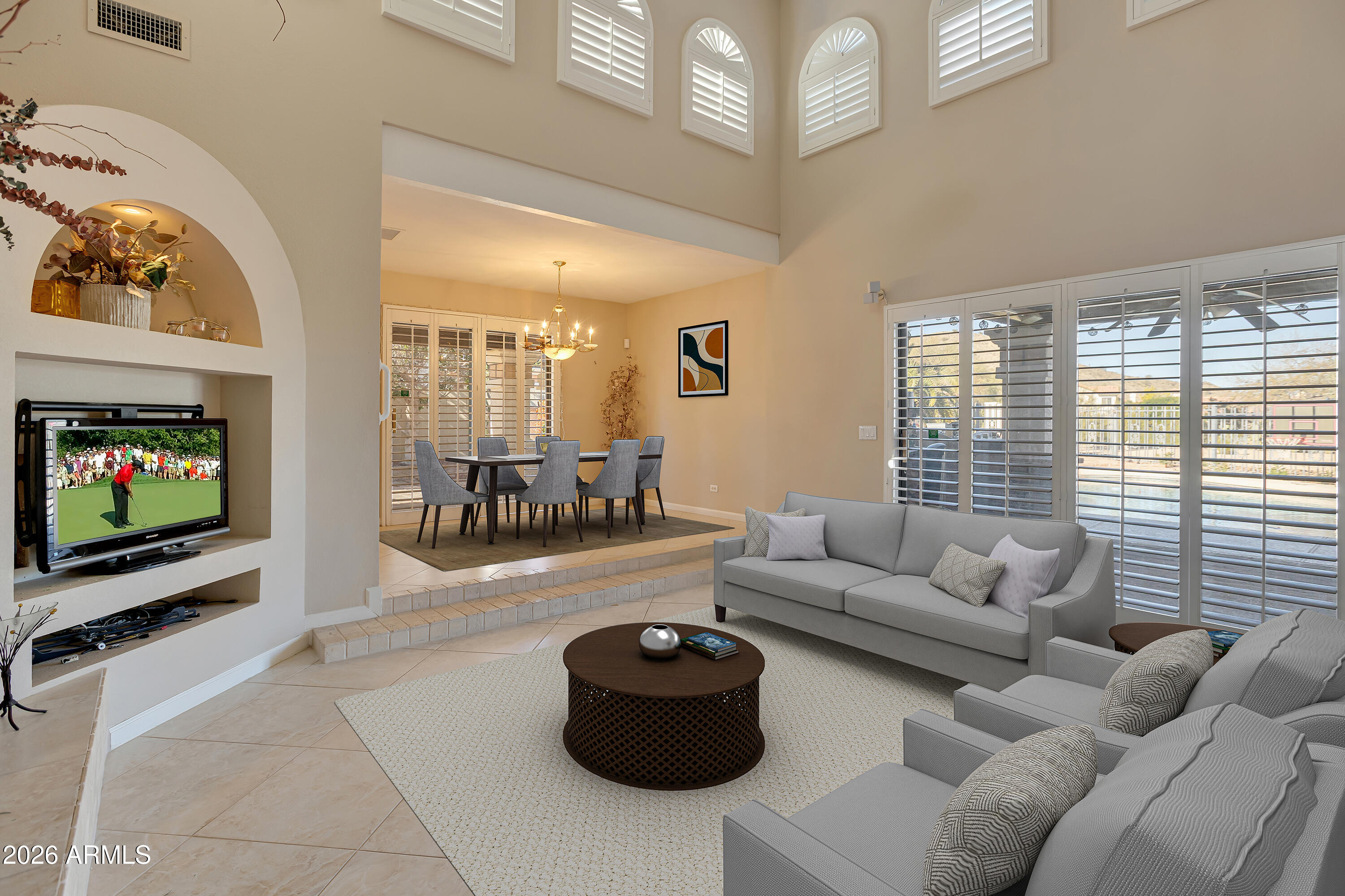 4610 East Monte Way Phoenix, AZ 85044 - Photo 5 of 44 a living room with furniture and a flat screen tv