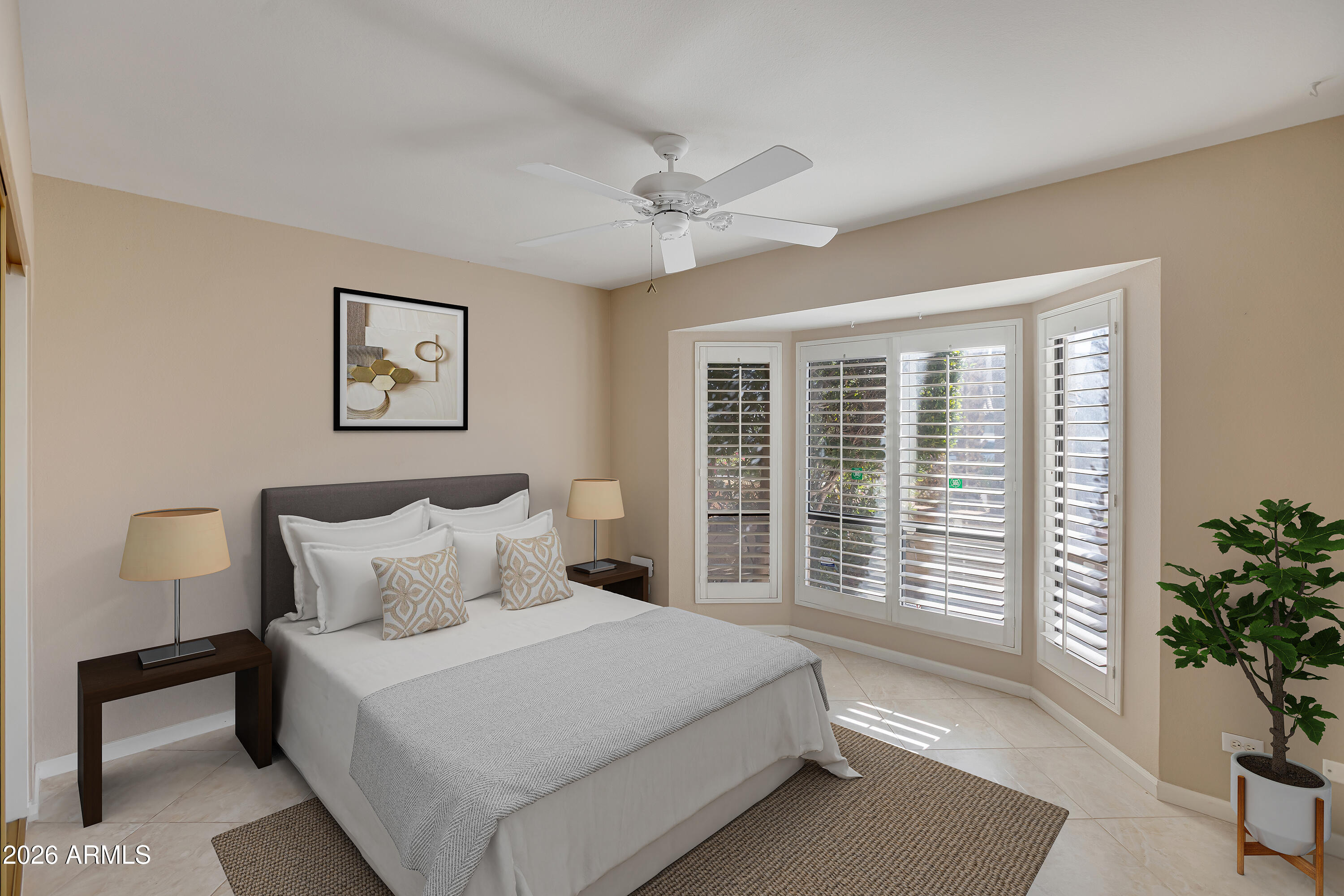4610 East Monte Way Phoenix, AZ 85044 - Photo 7 of 44 a bedroom with a large bed and a potted plant