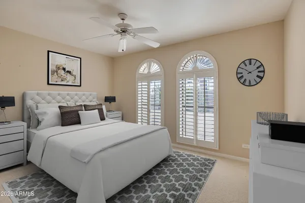 a bedroom with a large bed and a window