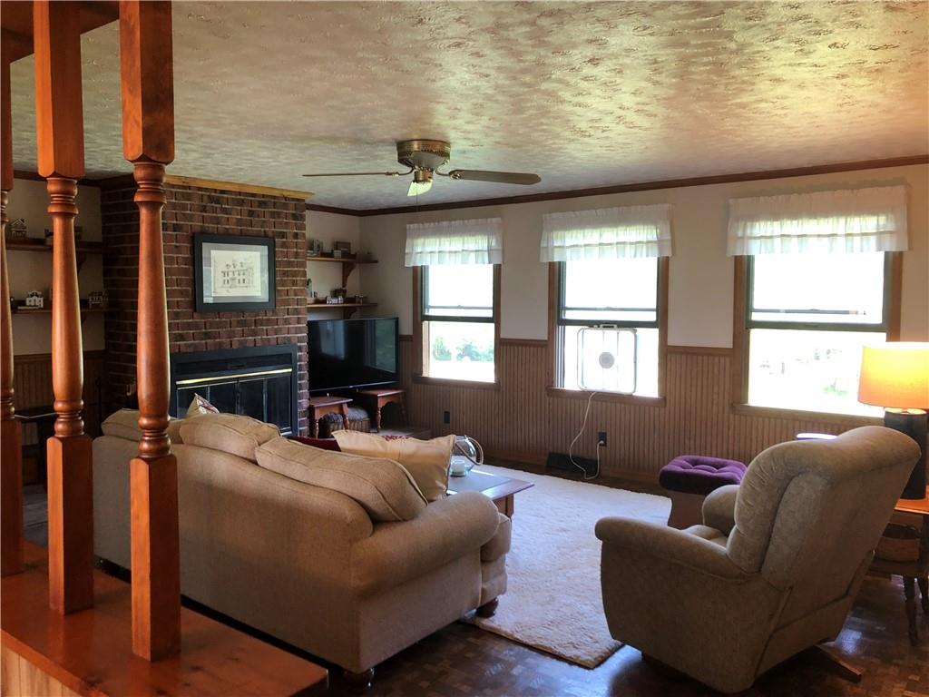 230 Locust Road Addison, PA 15411 - Photo 16 of 43 a living room with furniture and a window