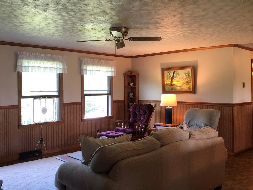230 Locust Road Addison, PA 15411 - Photo 17 of 43 a living room with furniture and a window