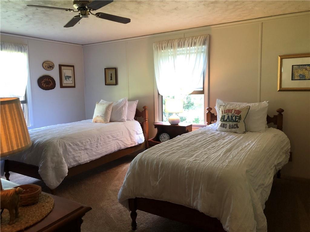 230 Locust Road Addison, PA 15411 - Photo 30 of 43 a bedroom with two beds and painting on the wall