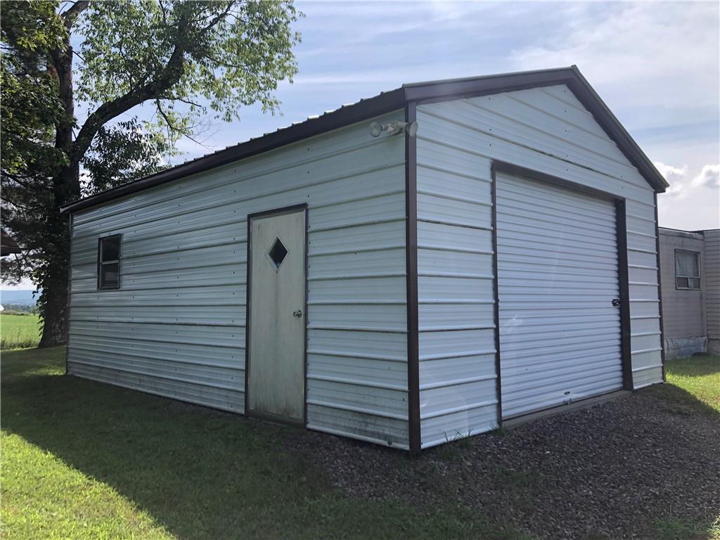 230 Locust Road Addison, PA 15411 - Photo 39 of 43 a view of a small house and a yard