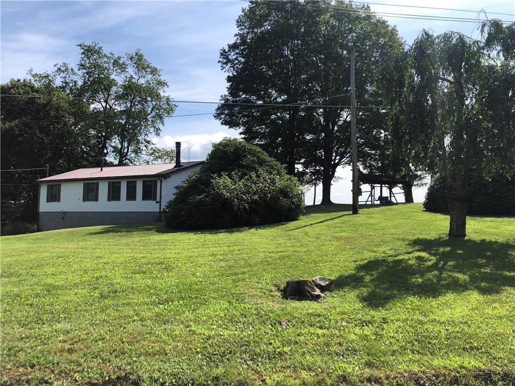 230 Locust Road Addison, PA 15411 - Photo 5 of 43 a house view with a garden space