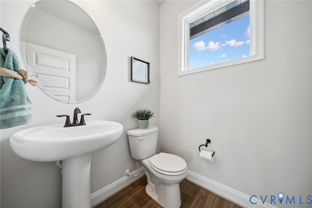 16116 Esteem Way Midlothian, VA 23113 - Photo 17 of 44 a white toilet sitting next to a white sink
