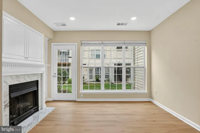 a view of livingroom with furniture and a fireplace