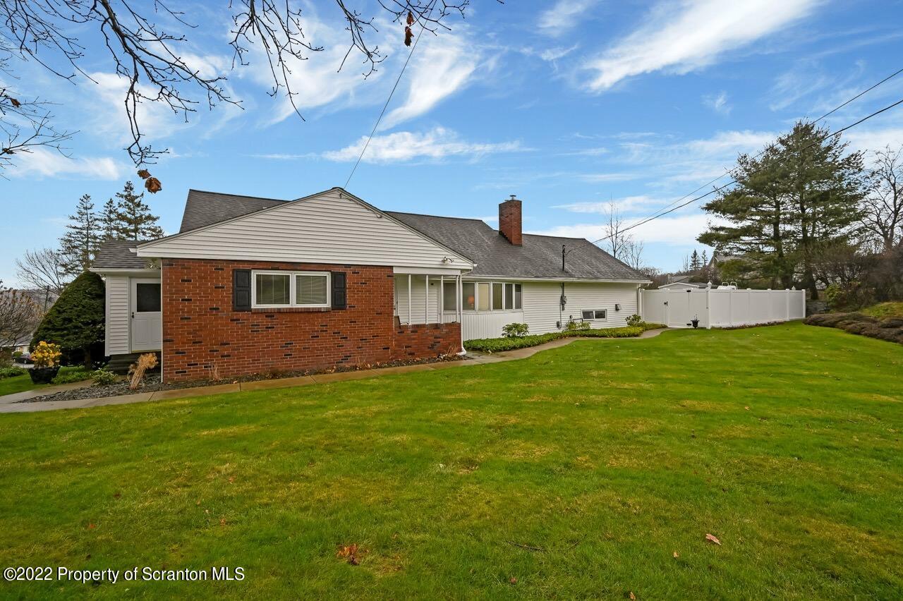 807 Layton Road Clarks Summit, PA 18411 - Photo 1 of 73 a front view of a house with a garden