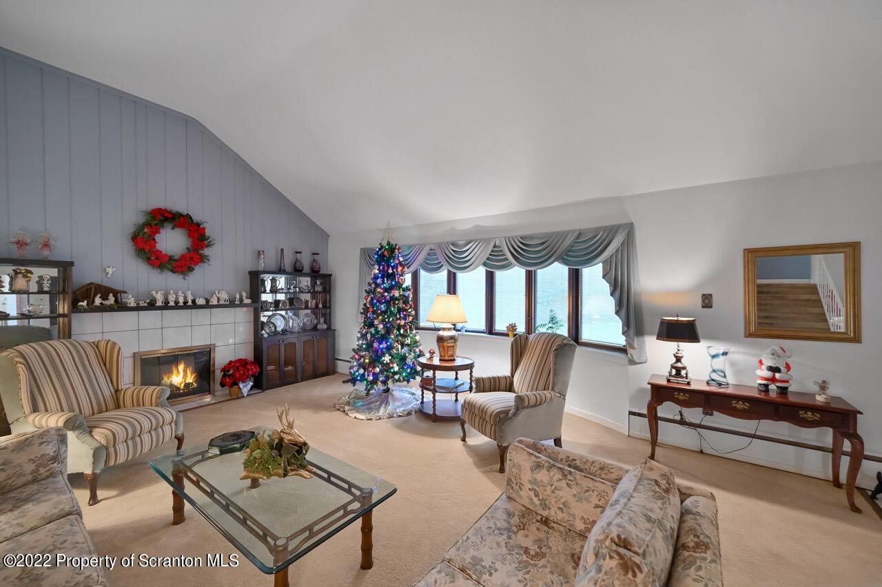 807 Layton Road Clarks Summit, PA 18411 - Photo 11 of 73 a living room with furniture and a fireplace