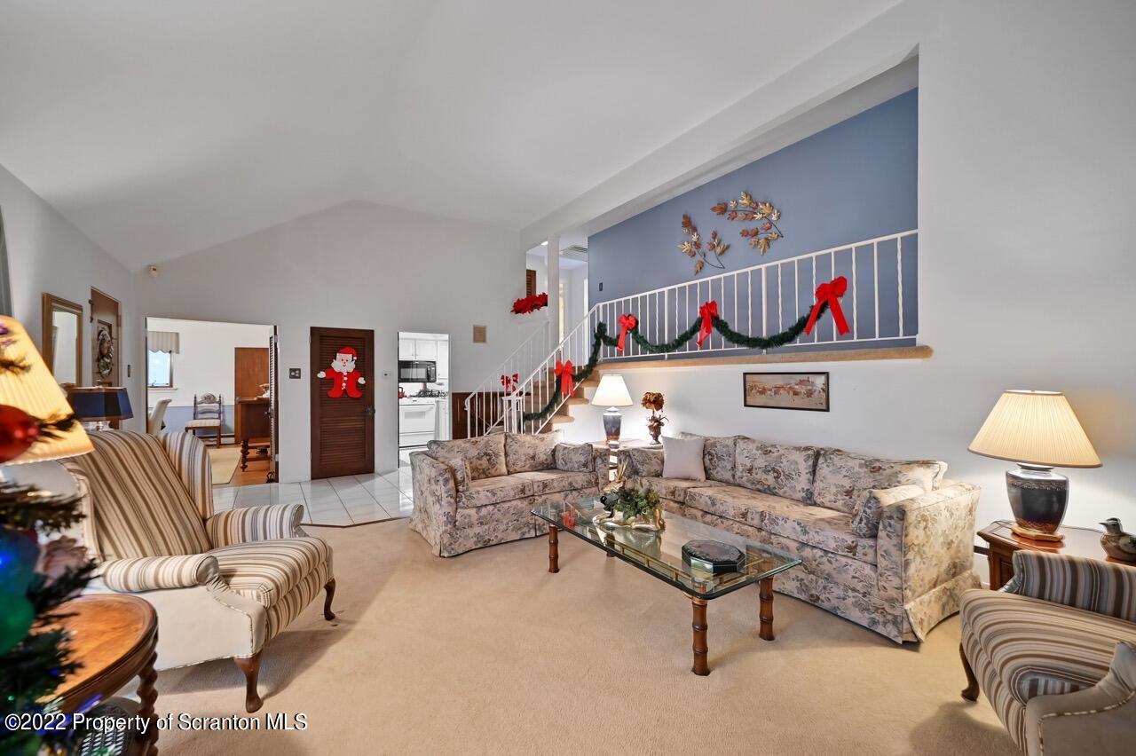807 Layton Road Clarks Summit, PA 18411 - Photo 14 of 73 a living room with furniture and a couch