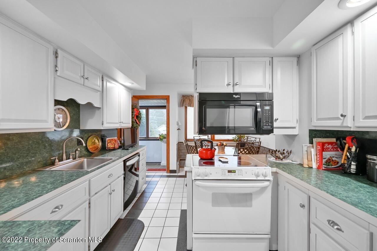 807 Layton Road Clarks Summit, PA 18411 - Photo 19 of 73 a kitchen with counter top space cabinets and appliances