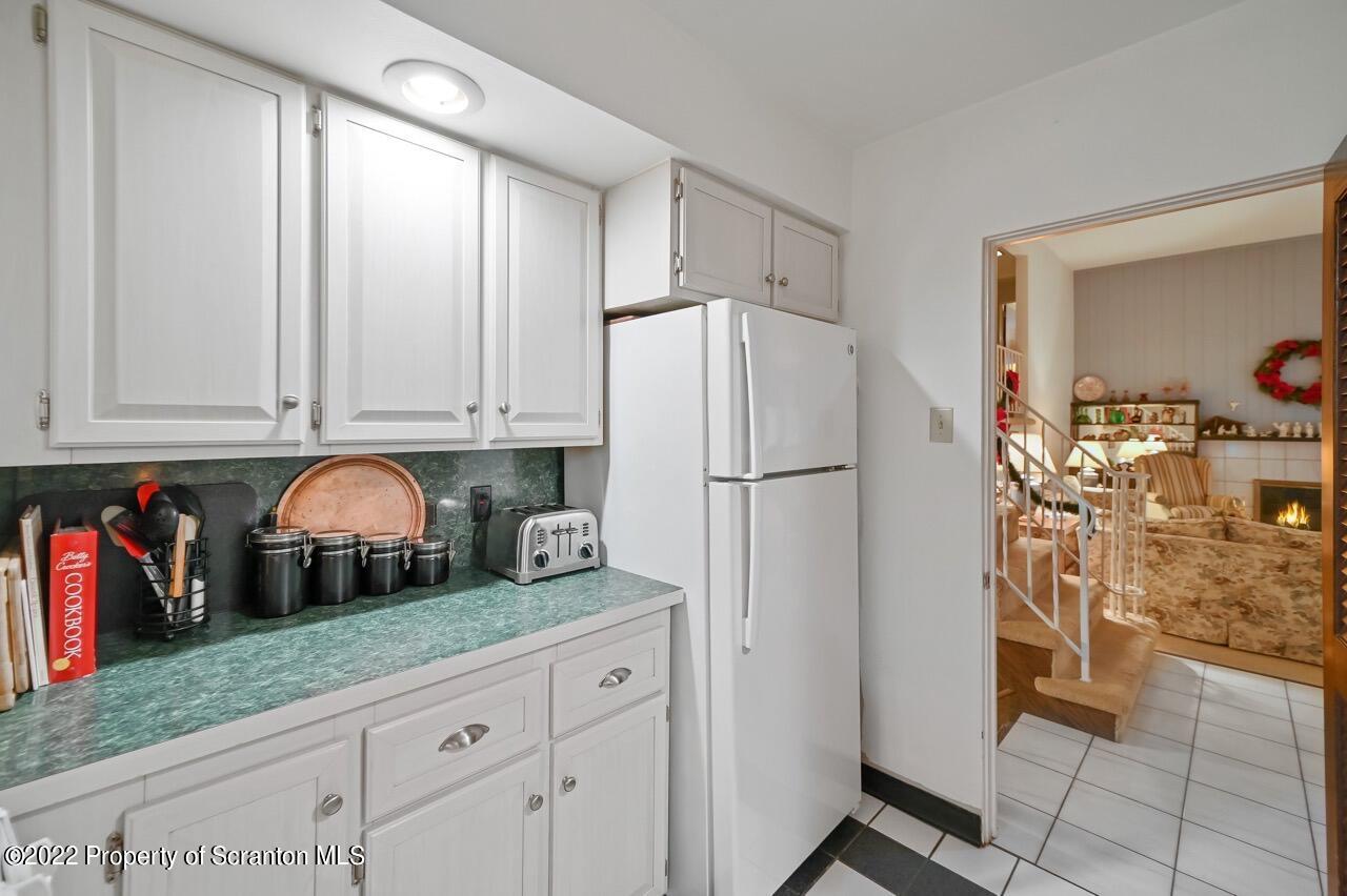807 Layton Road Clarks Summit, PA 18411 - Photo 21 of 73 a kitchen with stainless steel appliances granite countertop a refrigerator and a sink