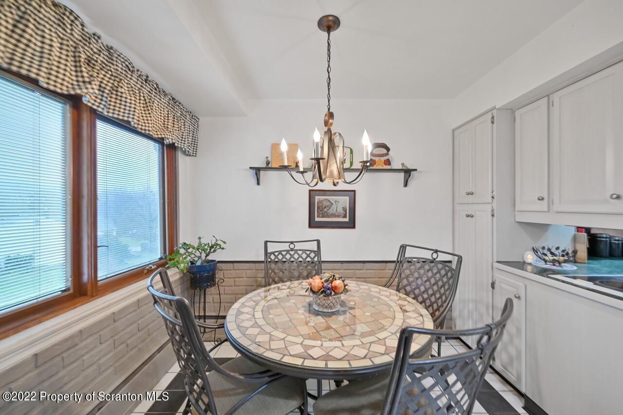 807 Layton Road Clarks Summit, PA 18411 - Photo 25 of 73 a view of a dining room with furniture window and wooden floor
