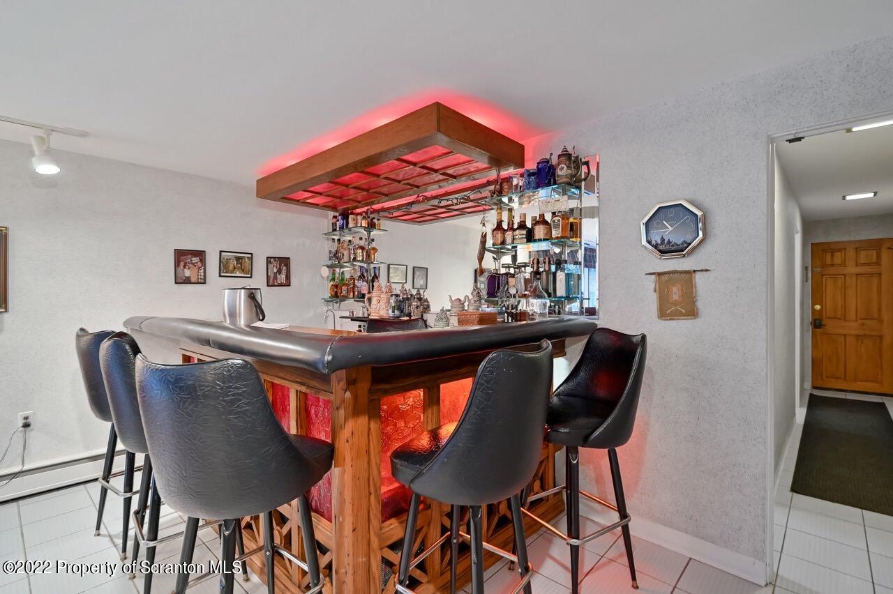 807 Layton Road Clarks Summit, PA 18411 - Photo 33 of 73 a dining room filled chandelier and wooden floor