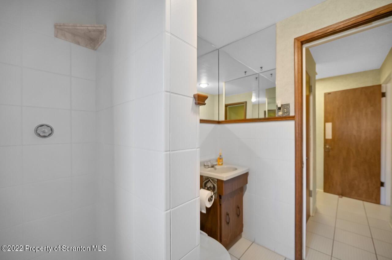 807 Layton Road Clarks Summit, PA 18411 - Photo 37 of 73 a bathroom with a sink and a mirror