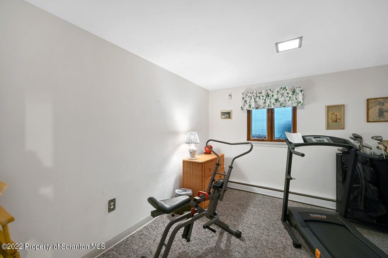 807 Layton Road Clarks Summit, PA 18411 - Photo 39 of 73 a room with furniture and a window