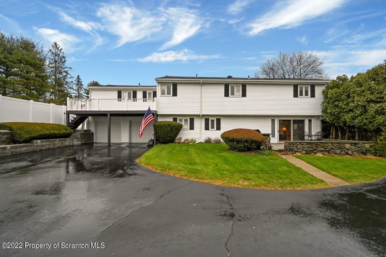 807 Layton Road Clarks Summit, PA 18411 - Photo 4 of 73 a view of a house with backyard sitting area and garden