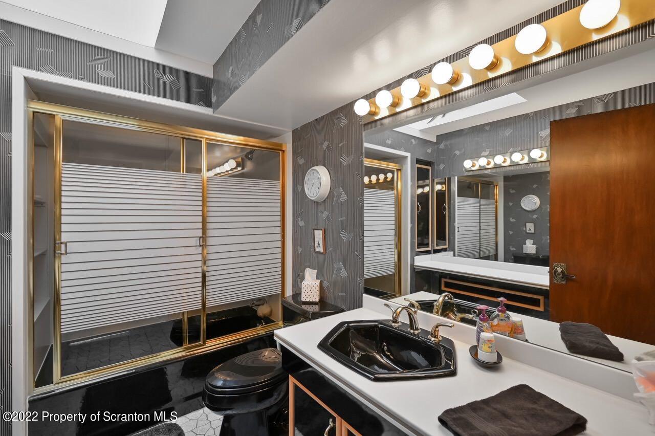 807 Layton Road Clarks Summit, PA 18411 - Photo 46 of 73 a bathroom with a sink and a mirror
