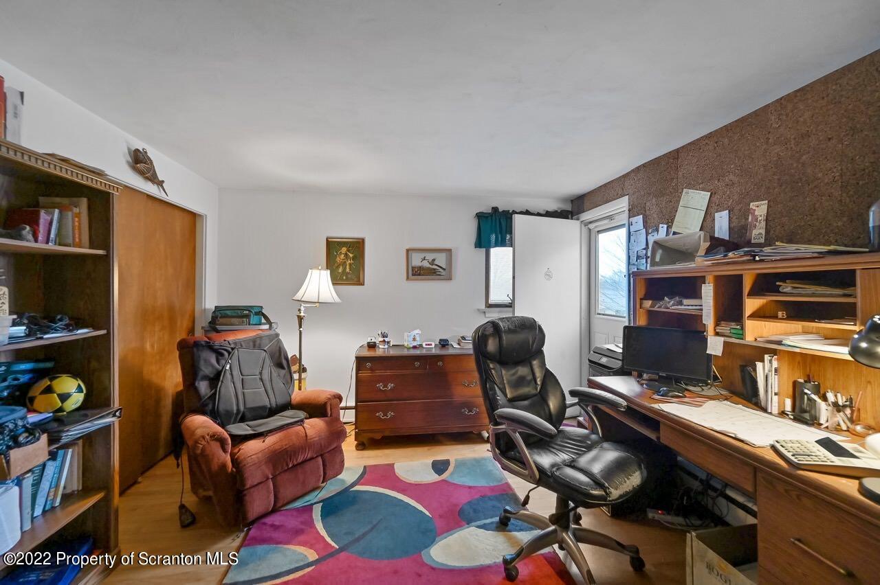807 Layton Road Clarks Summit, PA 18411 - Photo 51 of 73 a livingroom with workspace and a couch