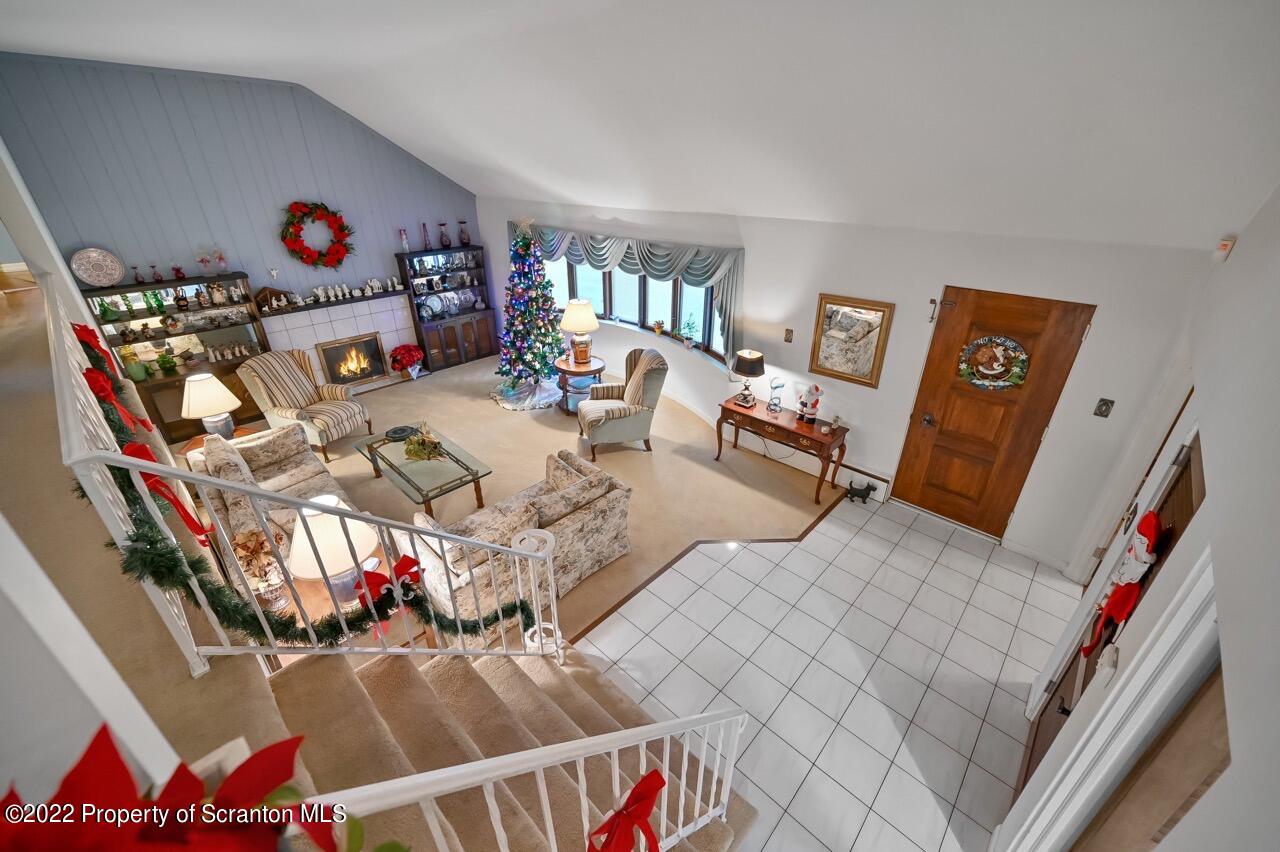 807 Layton Road Clarks Summit, PA 18411 - Photo 10 of 73 a living room with lots of furniture and a couch