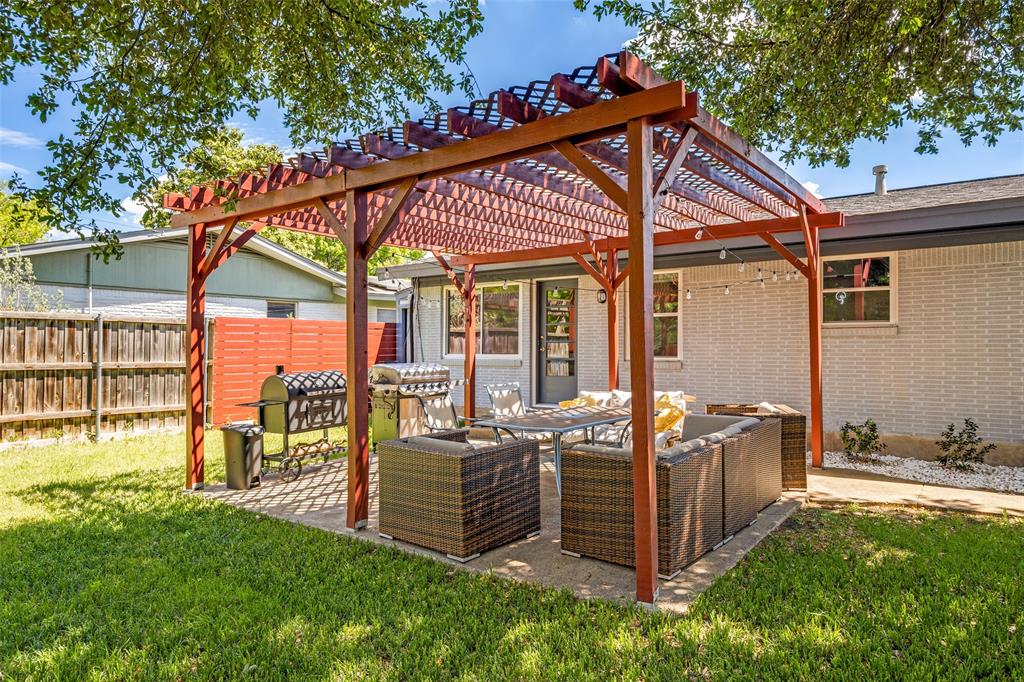 11021 Cactus Lane Dallas, TX 75238 - Photo 22 of 26 a view of a house with a backyard and balcony