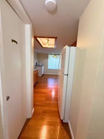 a view of a kitchen from the hallway