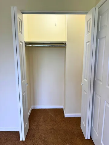 a view of a big room with carpet