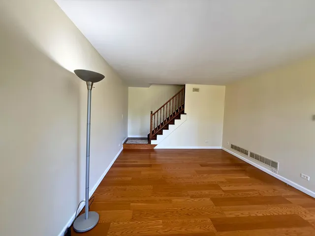 a view of an empty room with stairs