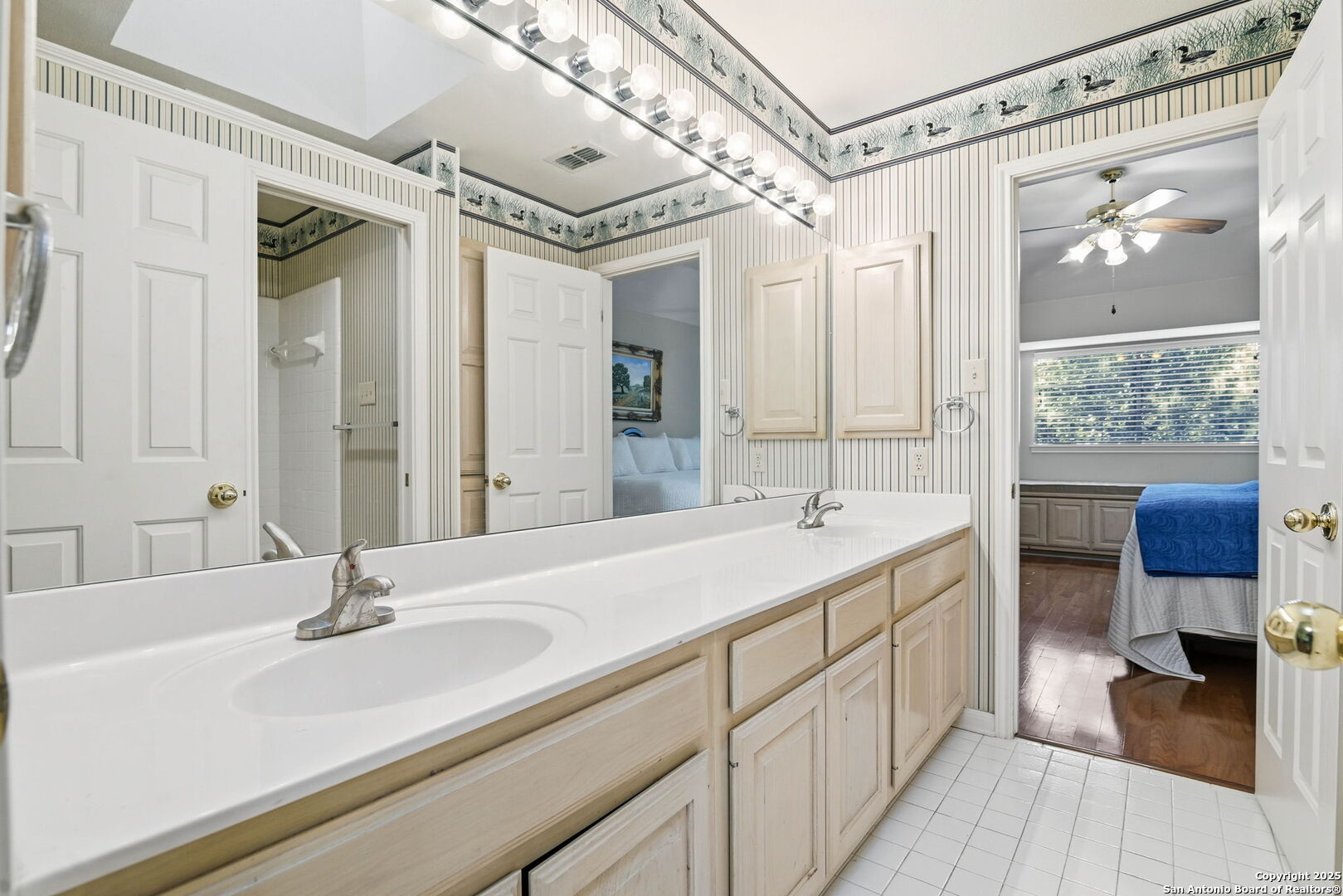 15 Inwood Point San Antonio, TX 78248 - Photo 17 of 27 a bathroom with a double vanity sink and a mirror
