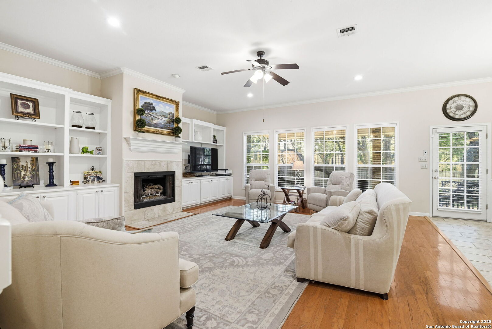 15 Inwood Point San Antonio, TX 78248 - Photo 6 of 27 a living room with furniture large window and a fireplace