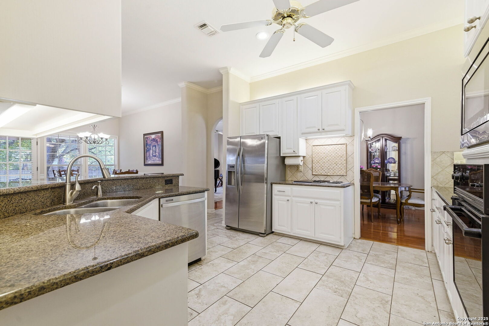 15 Inwood Point San Antonio, TX 78248 - Photo 9 of 27 a kitchen with stainless steel appliances granite countertop a sink counter space cabinets and stainless steel appliances