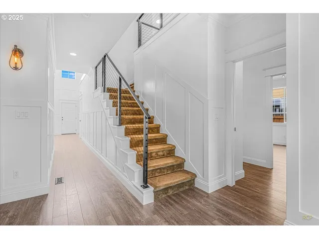 a view of entryway with wooden floor