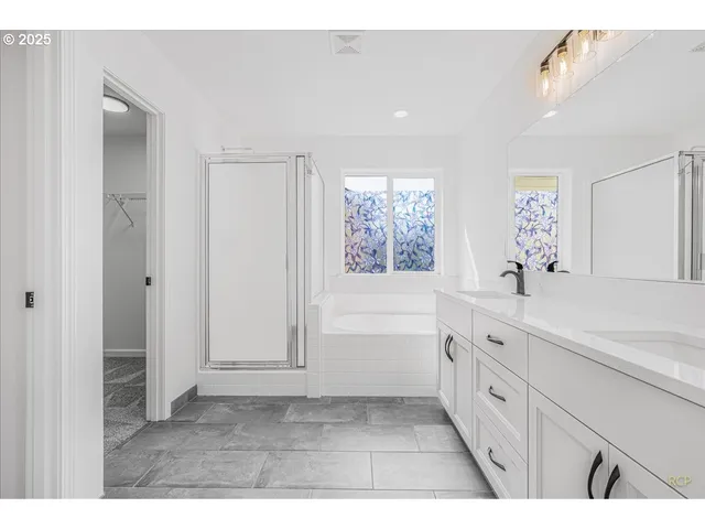 a bathroom with a sink a bathtub and a shower
